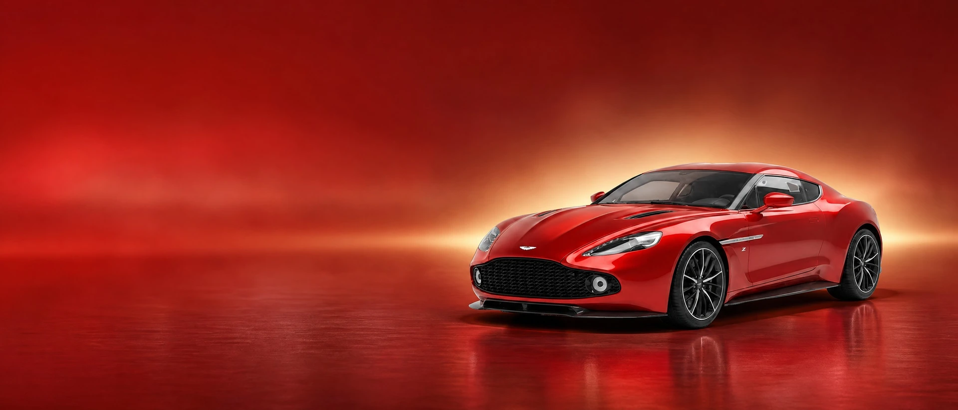 A red Aston Martin Vanquish Zagato, front three-quarter view on a carmine field with a gold bloom