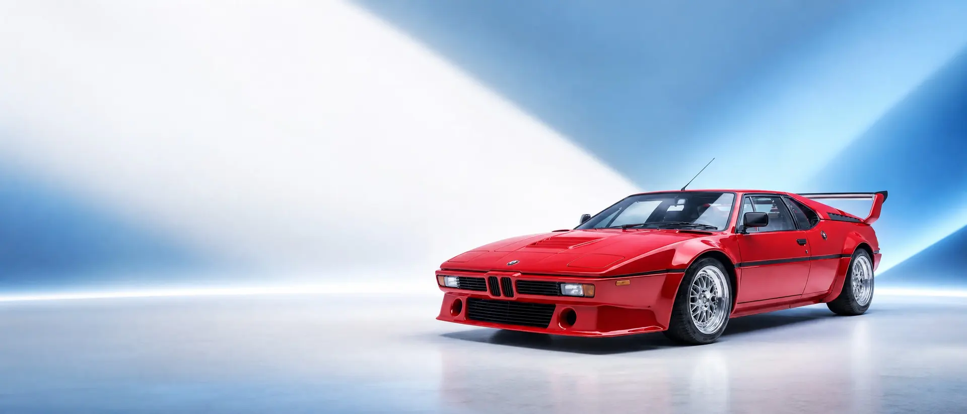 BMW M1 staged in a darkened scene