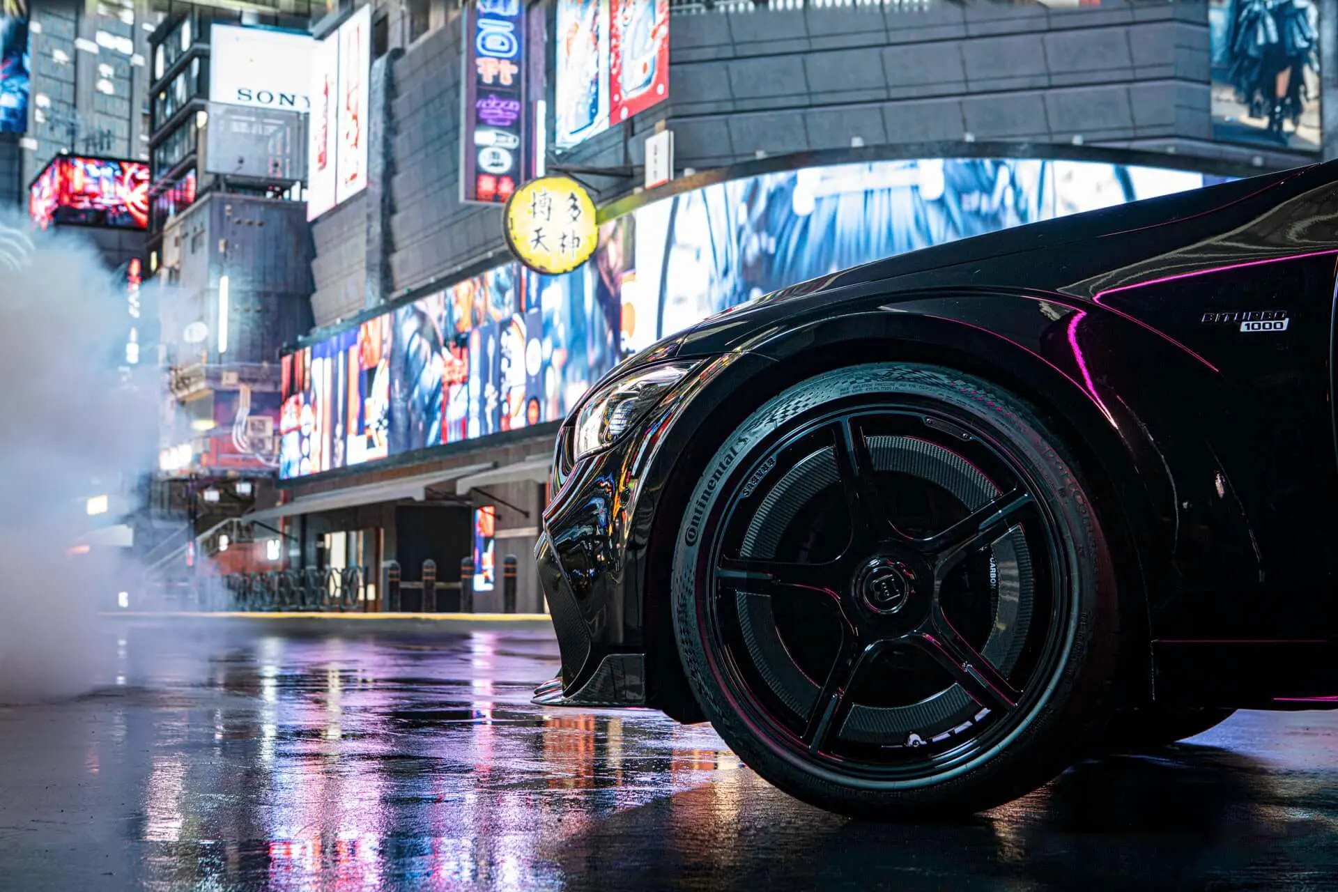 Brabus Rocket 1000 front wheel and Biturbo 1000 badge on a neon-lit Tokyo street