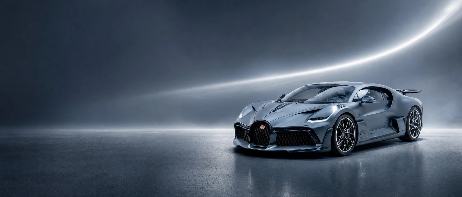 A slate-blue Bugatti Divo, front three-quarter view on a slate-blue field with a silver curve
