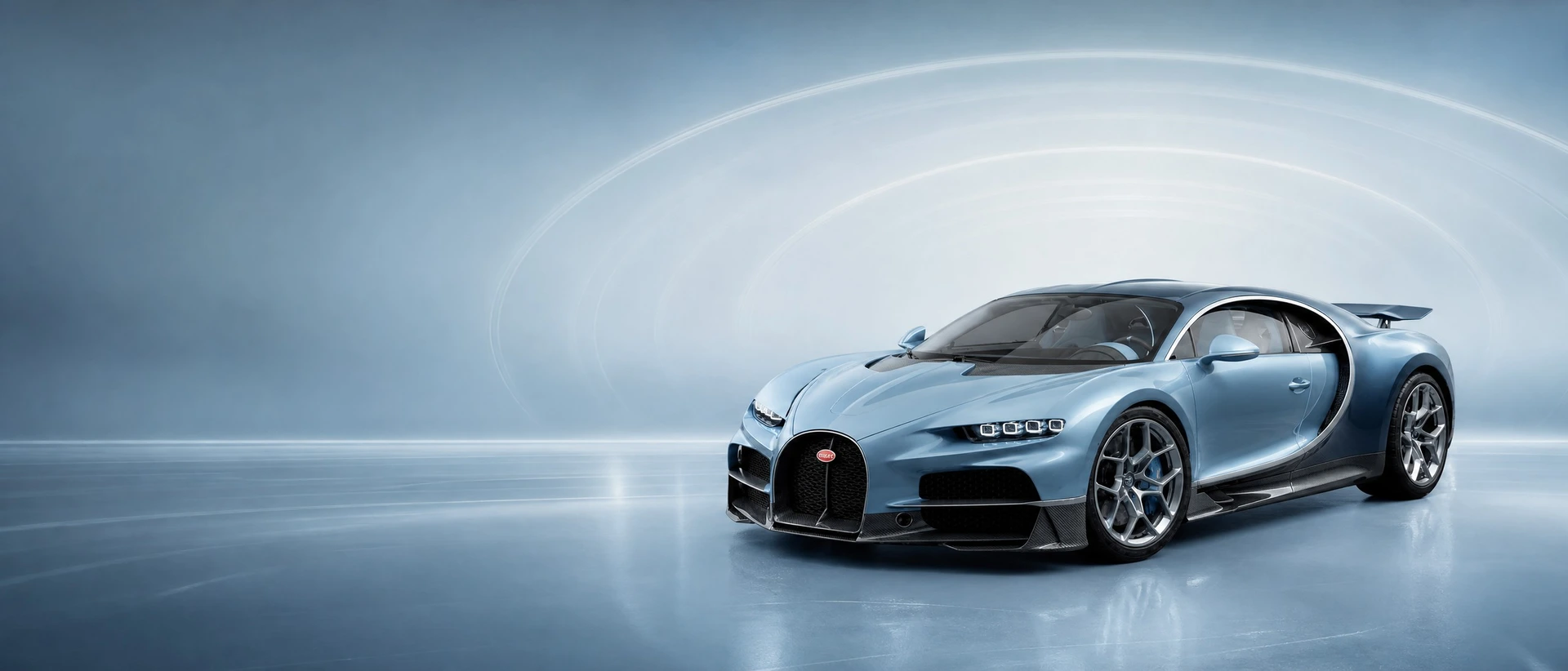 A pale blue Bugatti Tourbillon, front three-quarter view on a steel-blue field with concentric rings of light