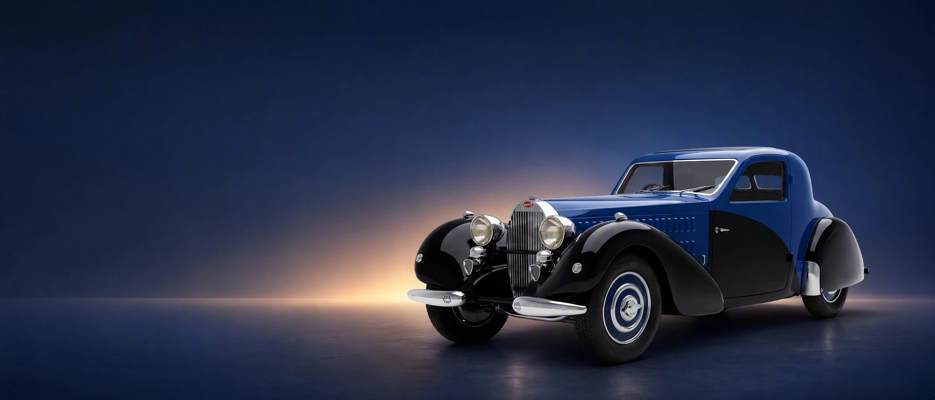 A dark blue Bugatti Type 57, front three-quarter view on a Prussian-blue field with lamplight glow
