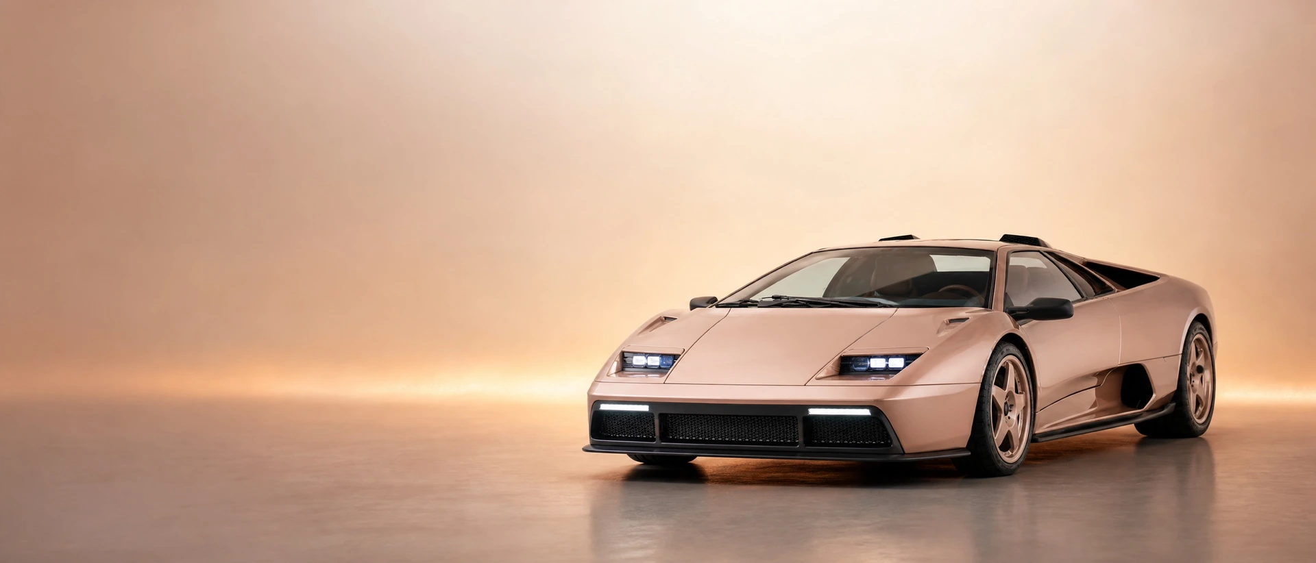 Eccentrica V12 in rose-gold, front three-quarter view on a warm rose-gold stage brightening to ivory