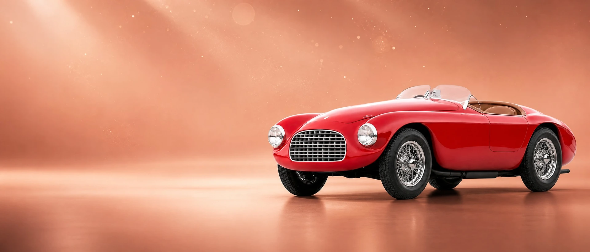A red Ferrari 166 MM barchetta, front three-quarter view on a rose-gold field with drifting light dust