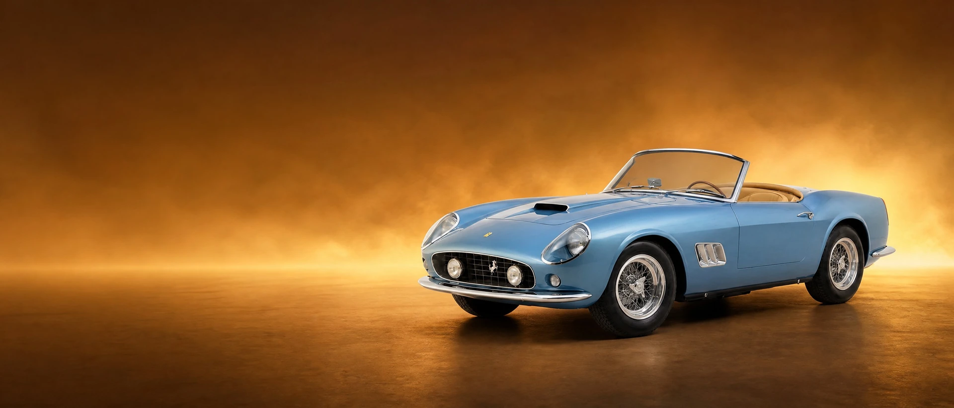 A light blue Ferrari 250 GT California Spider with the roof open, front three-quarter view on a warm amber field with glowing haze