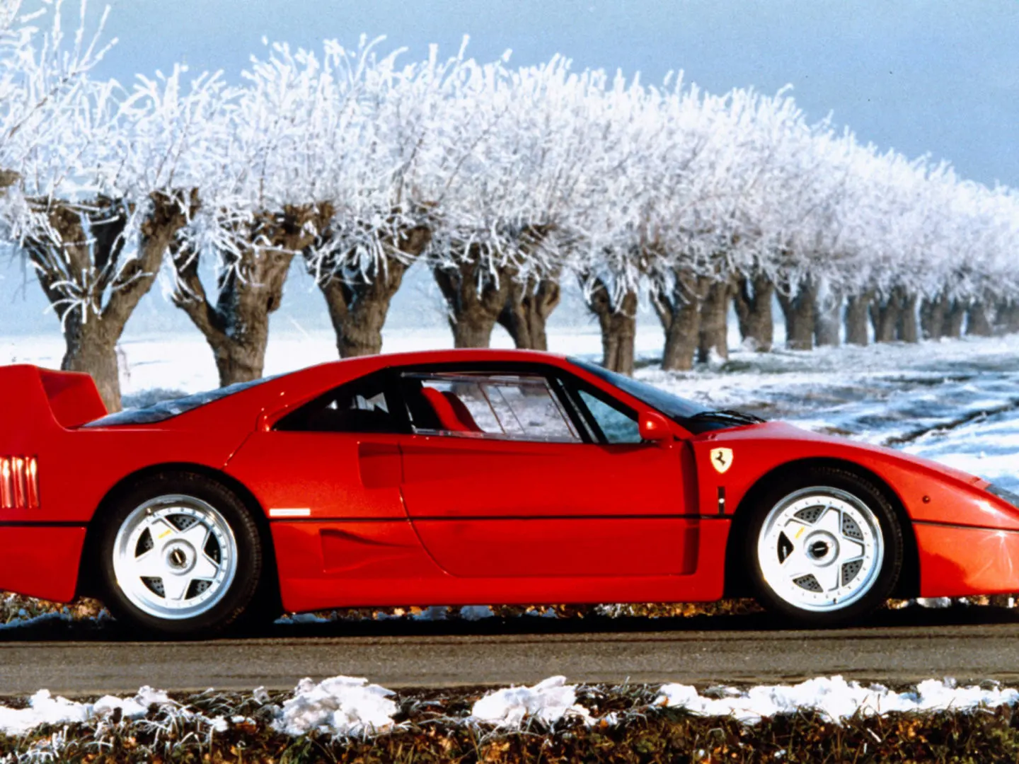 The F40 in profile against a frosted winter avenue