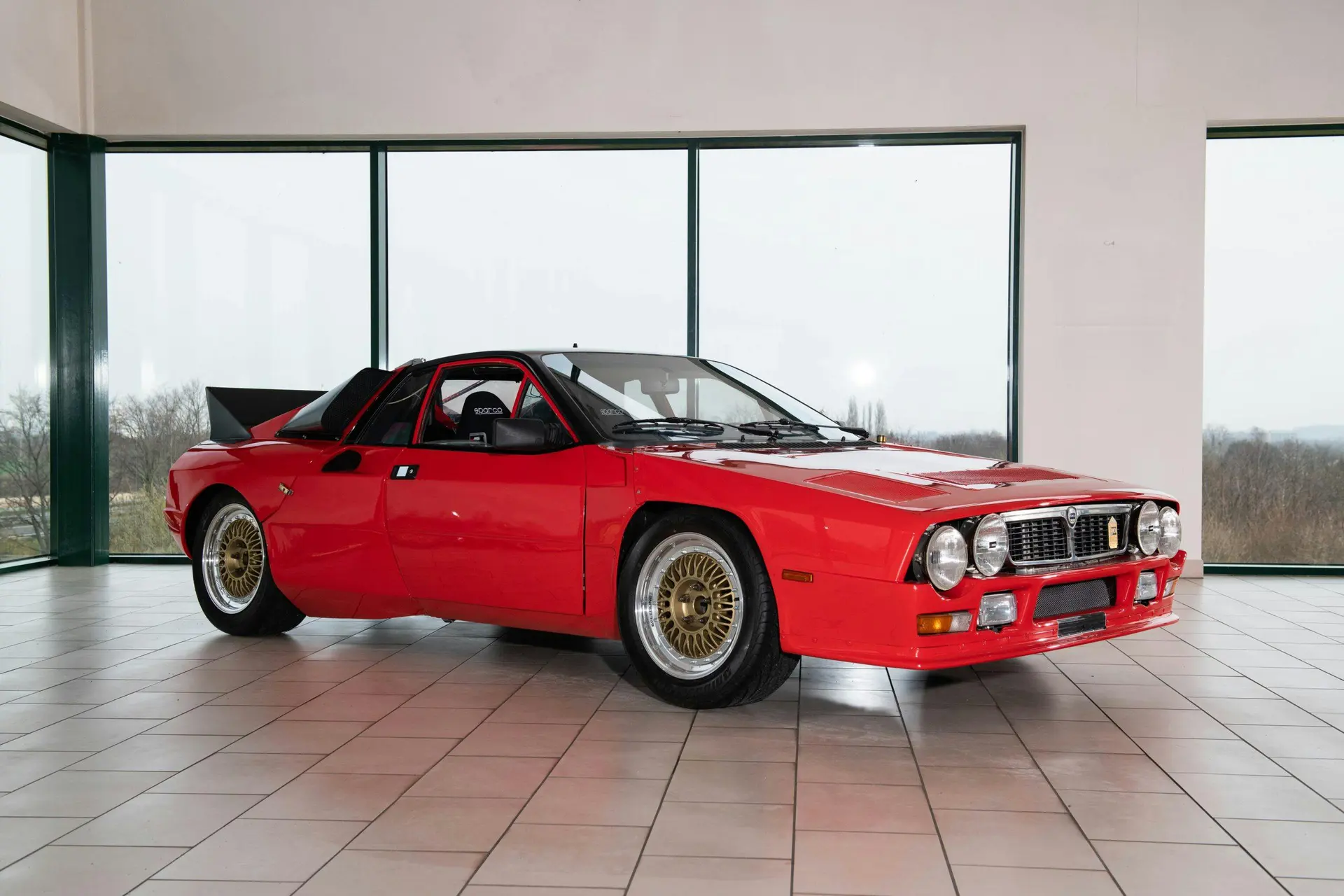 Red SE037 development prototype in a modern showroom