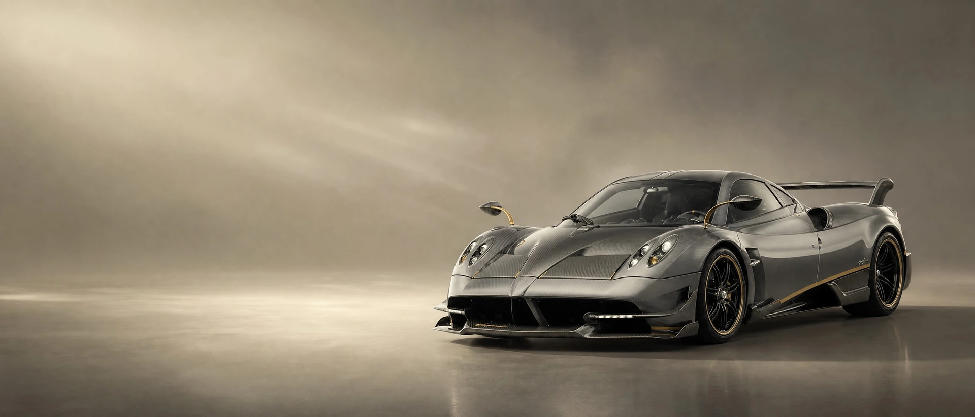 A grey-olive Pagani Huayra, front three-quarter view on a titanium field with polished-metal light