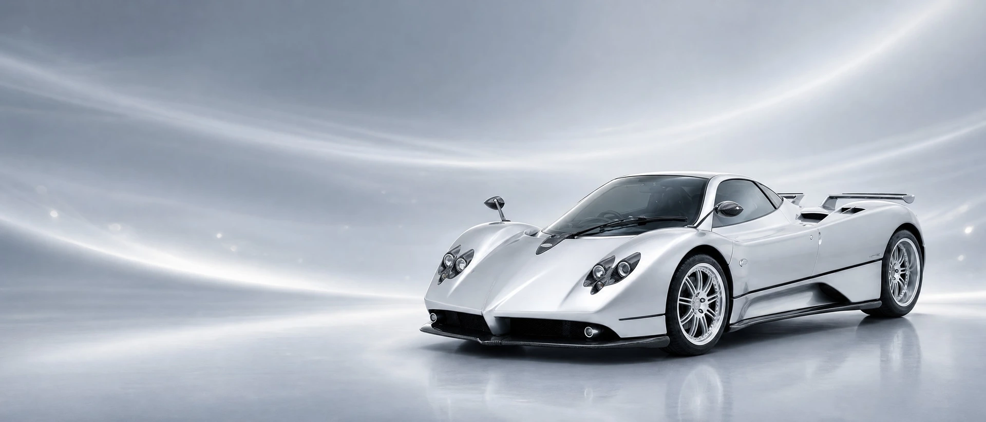 A silver Pagani Zonda, front three-quarter view on a blue-silver field with titanium glints