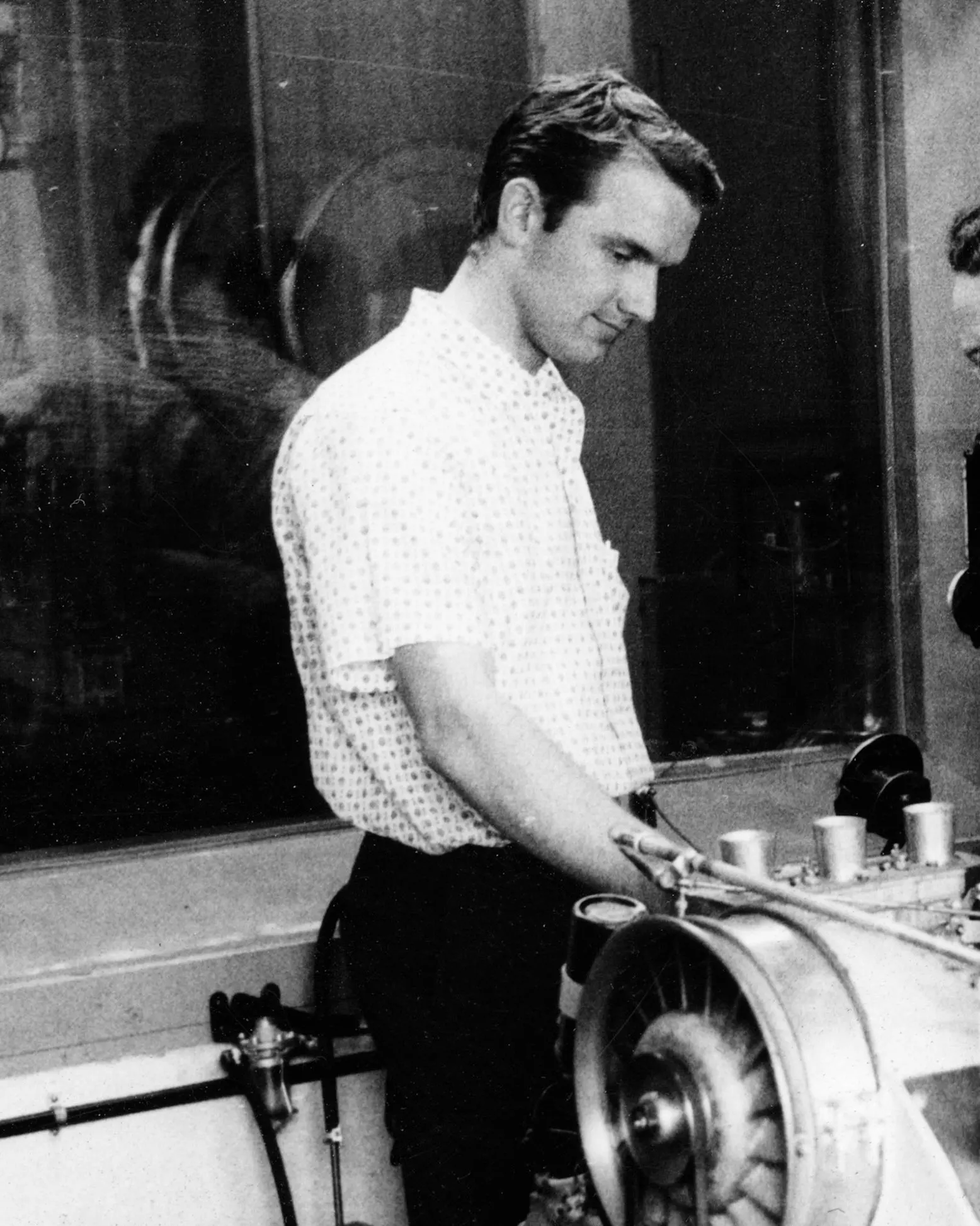 A young Ferdinand Piëch at the engine test bench, Ferry Porsche beside him — Porsche works, 1960s