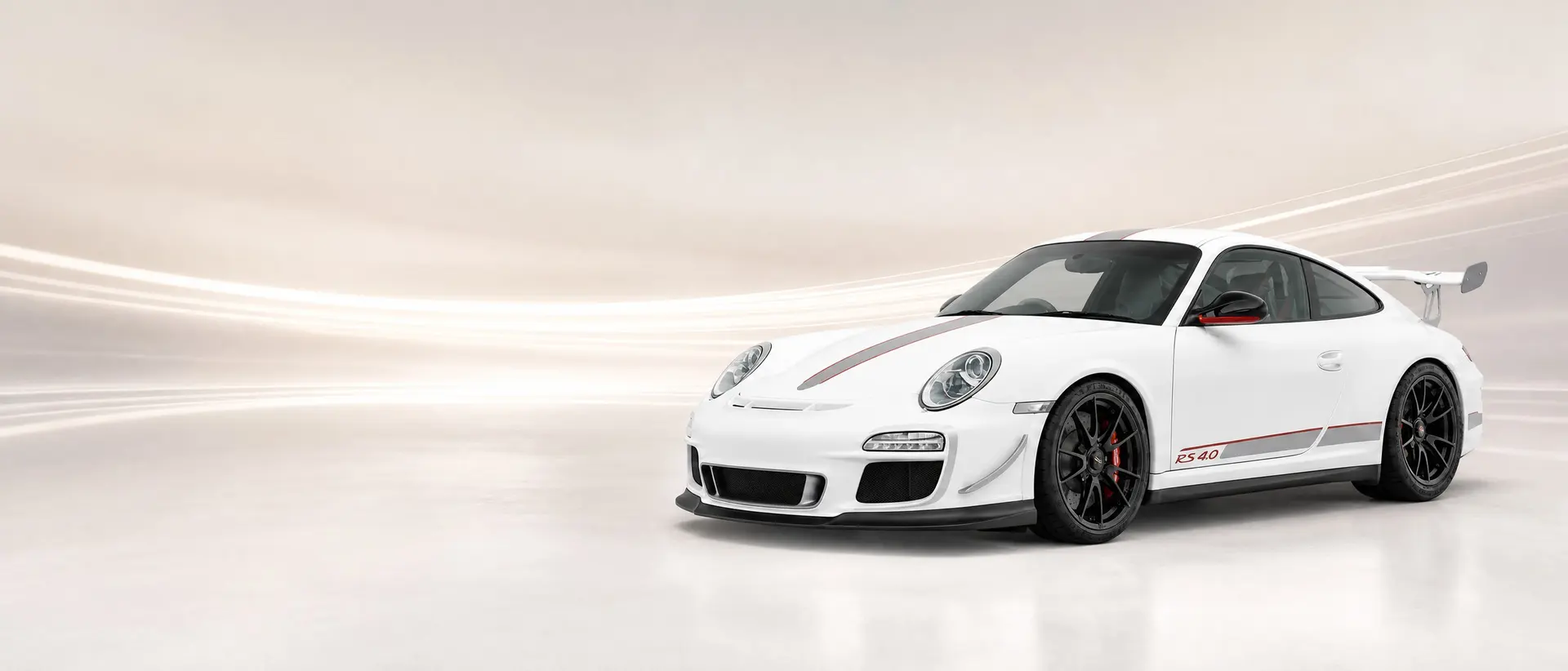 Porsche 997 GT3 RS 4.0 staged in a darkened scene