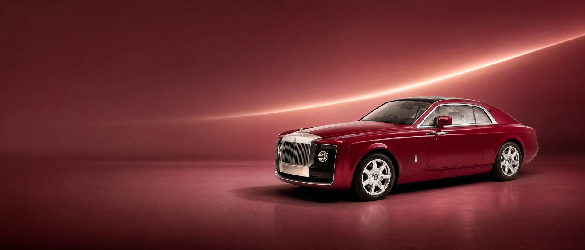 A burgundy Rolls-Royce Sweptail, front three-quarter view on a bright field with a swept line of light